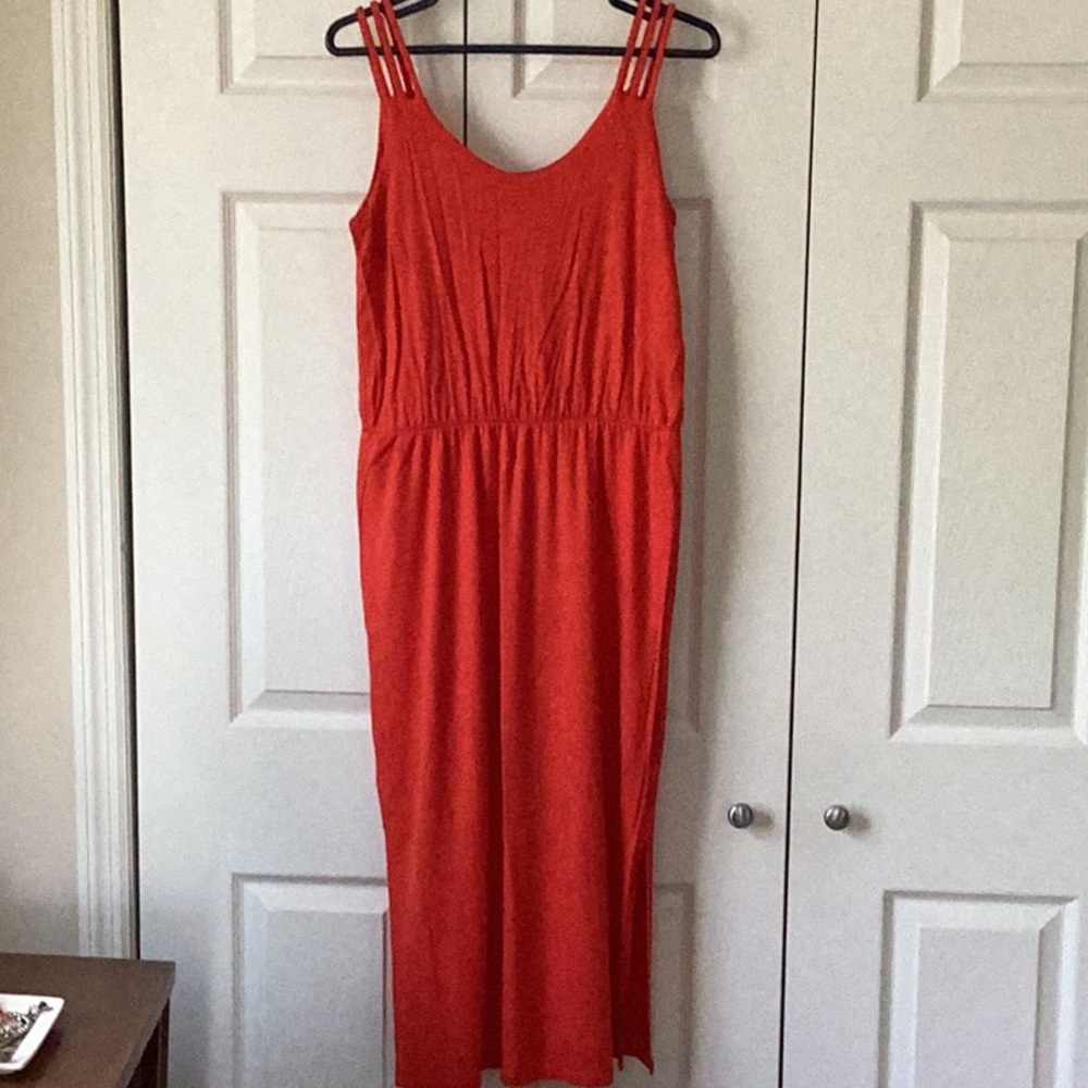 Lovely tomato-red sundress. Little braided straps, slit at the bottom.